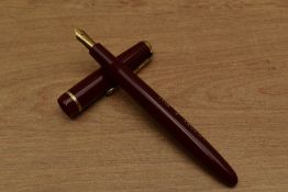 A Parker Victory Mk V aerometric fill fountain pen in red with narrow decorative cap band having