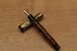 A Parker Duofold Junior button fill fountain pen in Black and Pearl with three bands to a Flat Top