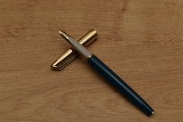 A Waterman cartridge fill fountain pen in Turquoise with gold trim having 14k nib. Circa 1971