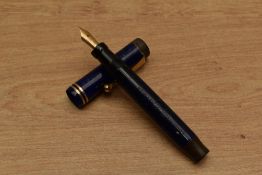 A Parker Duofold Junior button fill fountain pen in Lapis Lazuli Blue with two bands to flat top cap