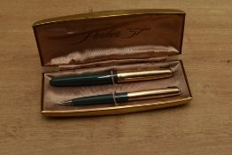 A boxed Parker 51 Aerometric fill fountain pen and clutch pencil in Navy Grey with gold filled