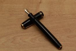 A Parker Vacumatic fountain pen in Opaque Black with three narrow cap bands having 14K Parker