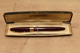 A boxed Sheaffer Valiant Touchdown Snorkel fill fountain pen in Burgundy having Sheaffer Made in USA