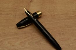A Sheaffer Pen For Men III snorkel fill fountain pen in Black with gold trim having Sheaffer 14k