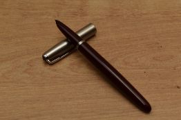 A Parker 51 aeromatric fill fountain pen in Burgundy with a lustraloy cap
