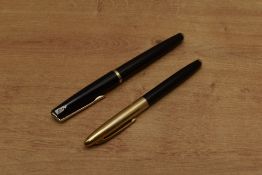 Two fountain pens. A Universal cartridge fill fountain pen in Black and a Mu-Neca aero fill (