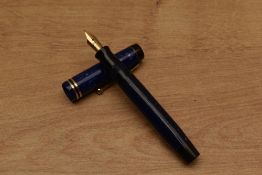 A Parker Duofold Junior streamlined button fill fountain pen in Lapis Lazuli with two narrow cap