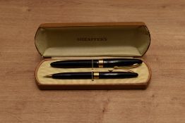 A boxed Sheaffer Touchdown fill fountain pen and pencil set in Black having Sheaffer 79 Lifetime