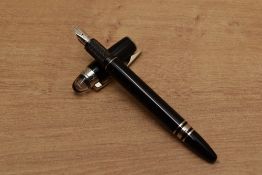 A Montblanc Starwalker cartridge fill fountain pen in Black with platinum trim having having