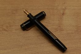 A Valentine lever fill fountain pen in Black with single narrow cap band having a Valentine 14C