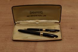 A boxed Sheaffer Touchdown Truimph snorkel fill fountain pen and pencil set Black having Sheaffer