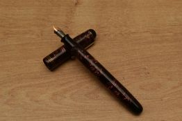 A Parker Televisor button fill fountain pen in Red Hatched with three cap bands having Parker