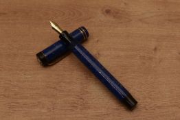 An Osmia Supra Normal button fill fountain pen in Lapis Lazuli Blue with two bands to the flat top