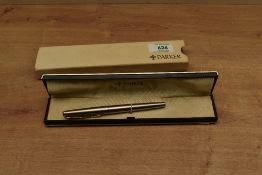 A boxed Parker Falcon converter fill fountain pen in Brushed Stainless Steel. Circa 1985