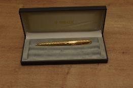 A boxed Parker 75 ballpoint pen in gold plated Millerais pattern