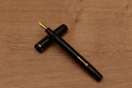 A Conway Stewart 540 lever fill fountain pen in Black with single cap band (missing clip) having