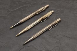 Three hexaganal Hallmarked Silver Yard O Led pencils. 55g. Some dents