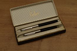 A boxed Parker 51 aerometric fill fountain pen and clutch pencil set in Black with Lustraloy cap.