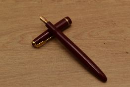 A Parker Duofold Junior aerometric fill fountain pen in Burgundy with narrow decorative cap band
