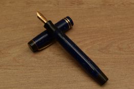 A Parker Duofold Junior Streamline button fill fountain pen in Lapis Lazuli Blue with two bands to