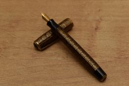 A Parker Vacumatic Golden Web fountain pen having two narrow cap bands. Engraved