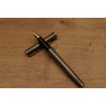 A Parker Premier converter fill fountain pen in Sterling Silver Cisele with gold trim having