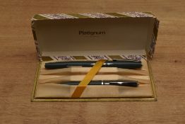 A boxed Platignum lever fill fountain pen and pencil set in Grey