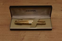 A boxed Sheaffer Imperial 777 converter fill fountain pen and ballpoint pen set in rolled gold