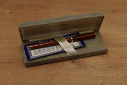 A boxed Ronson converter fill fountain pen in laque brown