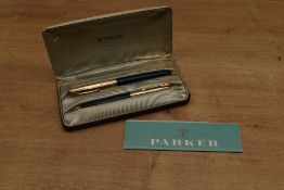 A boxed Parker 51 aerometric fill fountain pen in Teal with Rolled Gold converging line cap. Circa