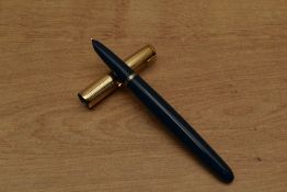 A Parker 51 Aerometric fill fountain pen in Teal Blue with rolled gold converging lined cap. Circa