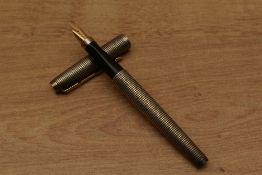 A Parker 75 converter fill fountain pen in Sterling Silver Cicele having Parker 14K Point USA nib.
