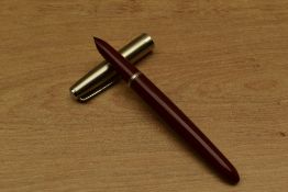 A Parker 21 Standard MkI aerometric fill fountain pen in Red with lustraloy cap. Circa 1948