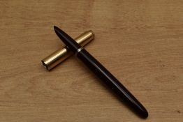 A Parker 51 Aerometric fill fountain pen in Burgundy with gold filled converging lined cap. Circa