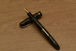 A Burnham No56 lever fill fountain pen in Green and Brown marble with two cap bands having Burnham