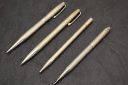 Four Hallmarked Silver pencils. Two Yard O Led, and advertising for Laura Lee Frocks (engraved)