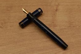 A Parker Duofold Special streamlined button fill fountain pen in Lapis Lazuli with two narrow cap