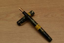 A Summit lever fill fountain pen in Green Marble with single cap band having Summit 14ct Gold nib.