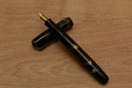 A Parker De Luxe Challenger button fill fountain pen in Green and Black with three narrow cap band