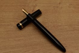 A Parker Duofold Maxima aerometric fill fountain pen in Black with decorative cap band having 14K