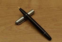 An Aurora 88 vacuum fill fountain pen in Black with Nikargenta cap. Circa 1949. Small ding to cap