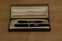A boxed Parker Duofold aerometric fill fountain pen and pencil in Black with Single decorative cap