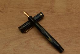 A Parker True Blue short button fill fountain pen with two bands to a Flat Top having Parker Lucky