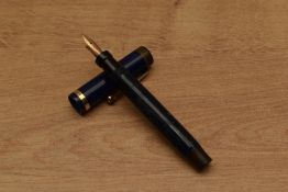 A Parker Duofold Junior button fill fountain pen in Lapis Lazuli with a single band to Flat Top
