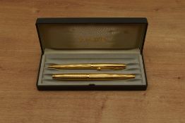 A boxed Parker 75 converter fill fountain pen and ballpoint pen set in Verdome Grain d'Orge gold