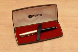 A boxed Parker 65 converter fill fountain pen in Black with gold filled converging line cap having