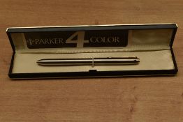 A boxed Parker Four Colour Ballpoint pen in Stainless Steel. Circa 1989