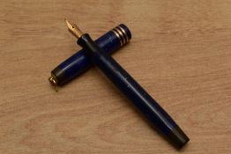A Parker Duofold Lady button fill fountain pen in Lapis Lazuli Blue with three narrow bands to