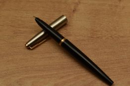 A Parker 45 cartridge fill in Black with lustraloy cap with gold trim. Circa 1960