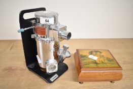A vintage Cyprane draw over vaporiser unit and a wooden Hummel 'After Rain Sunshine' musical